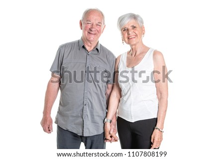Senior couple posing on studio white background