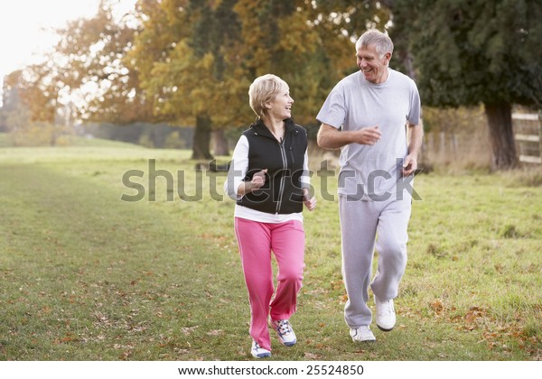 Senior Couple Power\
Walking In The Park