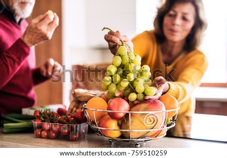 Similar – Image, Stock Photo Yellow and orange fruit and vegetables around white plate