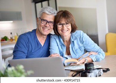 Senior Couple Preparing Vacation Trip