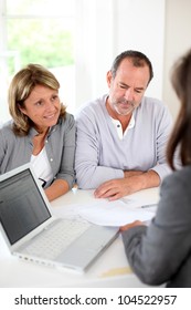 Senior Couple Ready To Buy New House Reading Contract