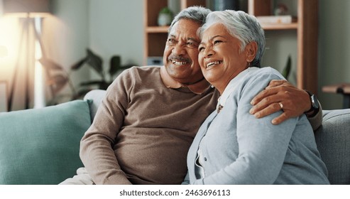 Senior, couple and relax watching tv on sofa with hug and love in marriage, retirement or vacation. Elderly, people and together on couch in home with trust, comfort and bonding with happiness - Powered by Shutterstock