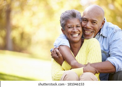 Senior Couple Relaxing In Autumn Landscape - Powered by Shutterstock