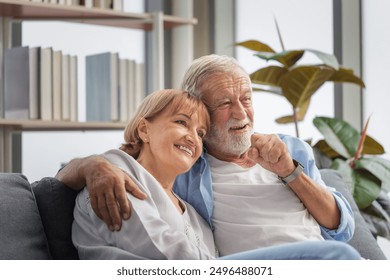 Senior couple relaxing at home watching movie, Man and woman watching TV together - Powered by Shutterstock