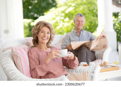 Senior couple relaxing on patio - Powered by Shutterstock