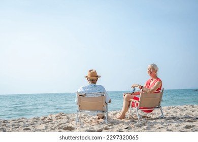 Senior couple relaxing on sea beach,Summer vacation,Travel and vacation on beach. - Powered by Shutterstock