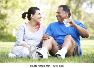 Senior Couple Resting After Exercise