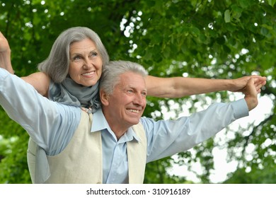 Senior couple resting at summer park