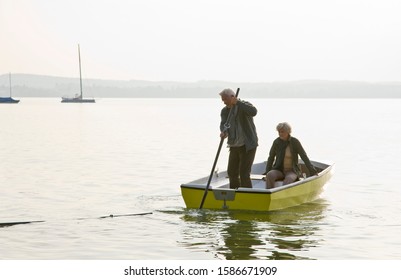 A Senior Couple In A Rowing Boat