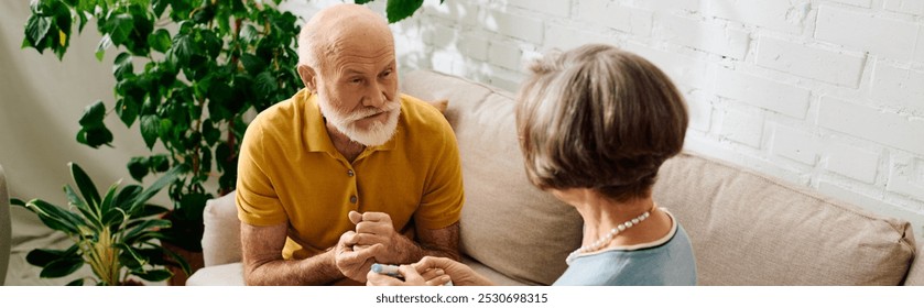 A senior couple shares a loving moment as the wife assists her husband with diabetes management. - Powered by Shutterstock