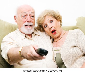 Senior Couple shocked by what they're watching on tv.  