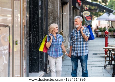Senior couple with shopping bags