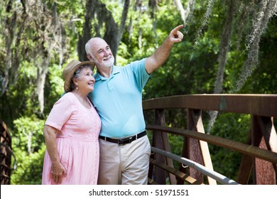 Senior Couple Sightseeing Together On Florida Vacation.