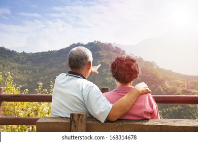 senior couple sitting on the bench looking the nature view - Powered by Shutterstock