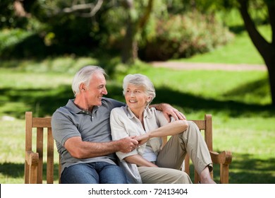 Senior Couple Sitting On A Bench