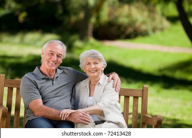 Senior Couple Sitting On A Bench