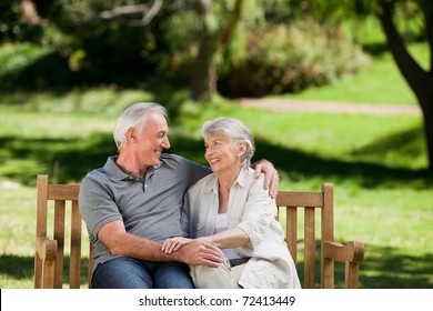 Senior Couple Sitting On A Bench