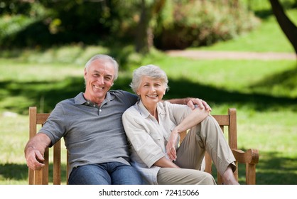 Senior couple sitting on a bench - Powered by Shutterstock