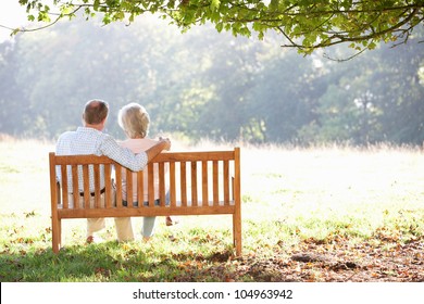 Senior Couple Sitting Outdoors