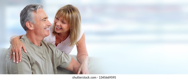 Senior couple smiling. - Shutterstock ID 1345669595