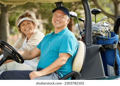 Senior couple smiling in golf cart - Powered by Shutterstock