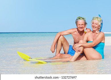 Senior Couple With Snorkels Enjoying Beach Holiday - Powered by Shutterstock