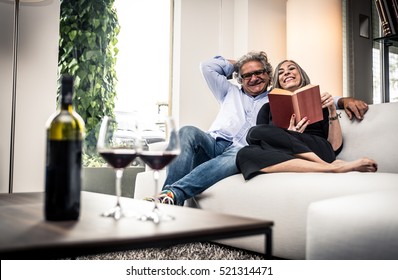 Senior couple spending time in the living room - Powered by Shutterstock