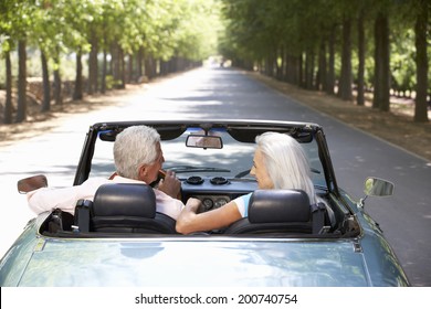 Senior Couple In Sports Car