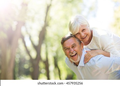 Senior Couple Standing Outdoors
