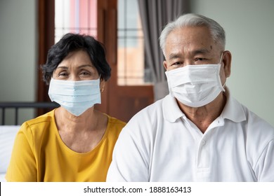 Senior Couple Staying Home And Wearing Face Mask, Concept Of Lockdown, Family Social Distancing, Wearing Mask And Keep Social Physical Distancing