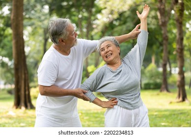 senior couple stretching before exercise and doing yoga in the park - Powered by Shutterstock