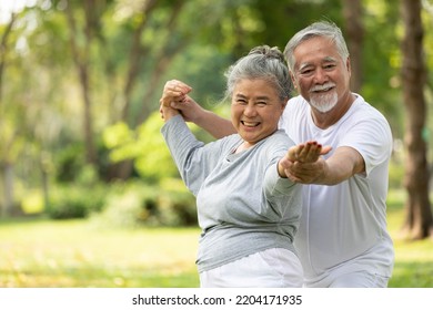 senior couple stretching before exercise and doing yoga in the park - Powered by Shutterstock