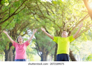 Senior Couple Taking A Deep Breath In The Park