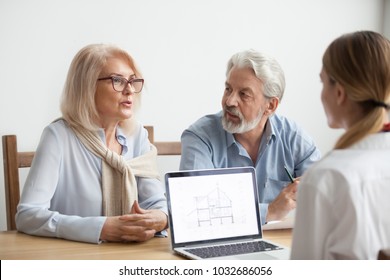 Senior couple talk to real estate agent about house purchase at meeting, interior designer advisor consulting older family with home plan on laptop screen, aged man and woman negotiating with realtor - Powered by Shutterstock