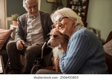 Senior couple with their dog relaxing at home - Powered by Shutterstock