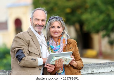 Senior Couple Of Tourists On A Trip