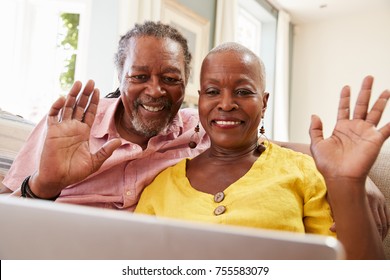 Senior Couple Using Laptop To Connect With Family For Video Call - Powered by Shutterstock