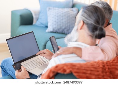 Senior couple using laptop and smartphone for online shopping with credit card, copy space. Seniors, technology, ecommerce, digital devices, internet, lifestyle - Powered by Shutterstock