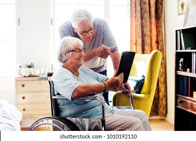 Senior couple using a tablet - Powered by Shutterstock