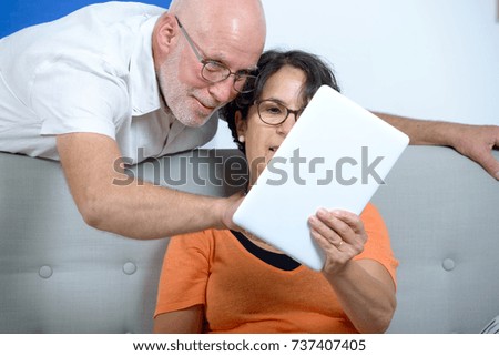 Similar – Female doctor showing results of a medical test on the tablet