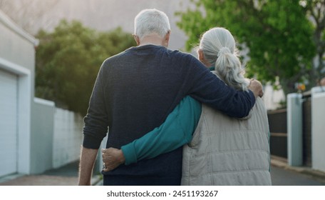 Senior couple, walk and hug in city, road and driveway of house for love, peace and support outdoor. Elderly people, freedom and retirement together in nature, environment or urban with back view - Powered by Shutterstock