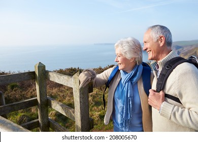 Senior Couple Walking Along Coastal Path - Powered by Shutterstock