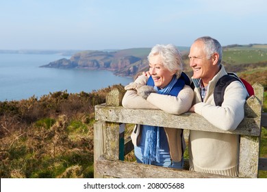 Senior Couple Walking Along Coastal Path - Powered by Shutterstock