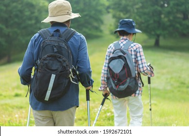 Senior couple walking in the mountains