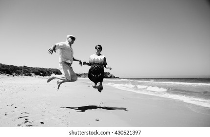 Senior Couple Walking On The Beach