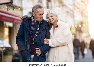 Senior Couple Walking On The City Street At Winter Day
