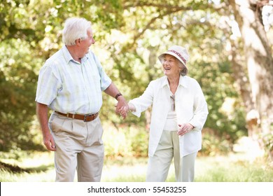 Senior Couple Walking In Park