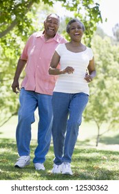 Senior Couple Walking Together Outside