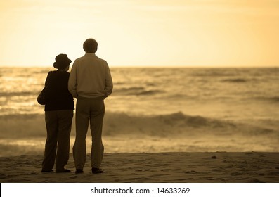 senior couple watching the sunset - Powered by Shutterstock