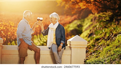 Senior couple, wine glasses and toast in outdoor for love, romance and relax in vineyard or nature. Elderly people, cheers and drink alcohol on vacation, holiday and calm celebration on anniversary - Powered by Shutterstock